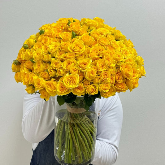 Yellow spray roses bouquet in vase